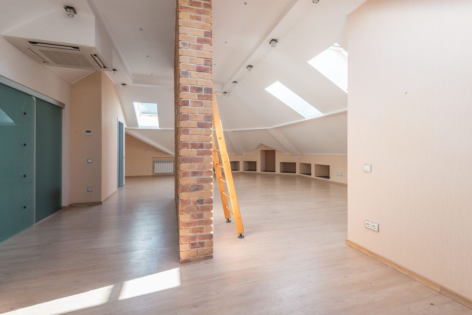 Bright finished loft room with roof windows in a Teesside home